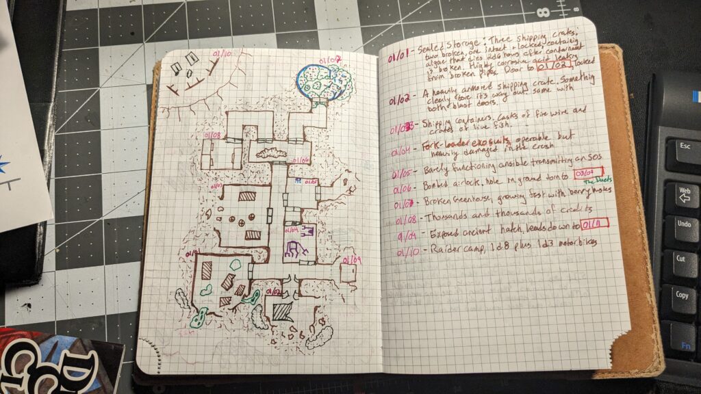 An open double page spread in a gridded journal. The left page features a map of a crashed spaceship, the right page features keyed rooms.